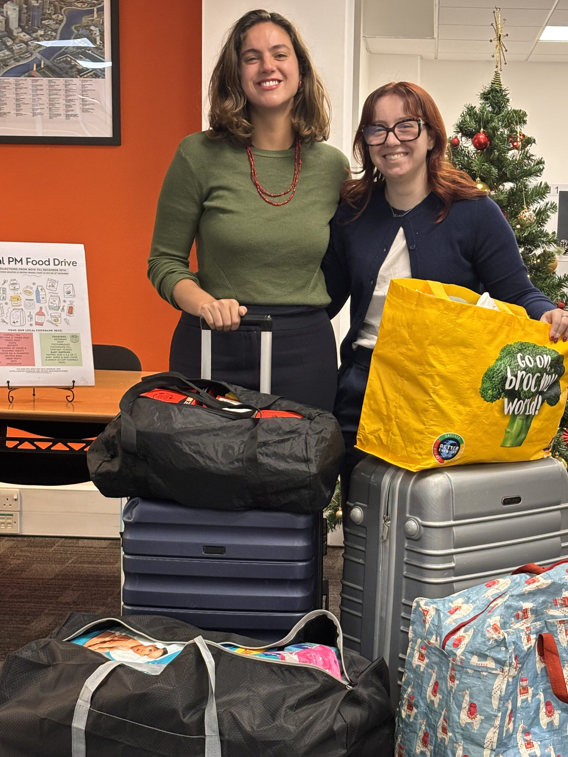 Real PM Food Drive - Sabrina and Neve with the donations